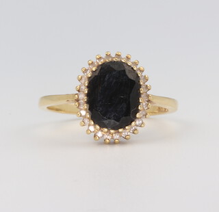 An 18ct yellow gold oval sapphire and diamond ring 4.1 grams, size N 