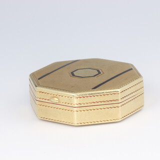 A 14ct yellow gold octagonal rouge box with mirrored interior, having black enamelled decoration 20 grams gross, 35mm 