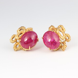 A pair of yellow metal stamped 14k ruby ear clips 8.8 grams (non pierced)
