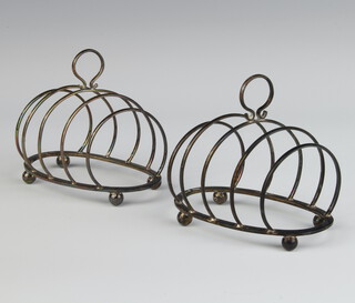 A pair of silver 5 bar oval toast racks, Birmingham 1922, 9.5cm, 112 grams 