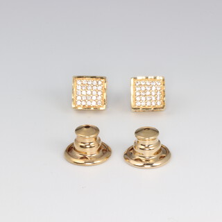 A pair of yellow  metal gem set ear studs 2.1 grams 