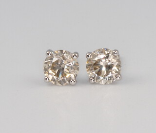 A pair of 18ct white gold brilliant cut diamond ear studs, approx. 1.09ct