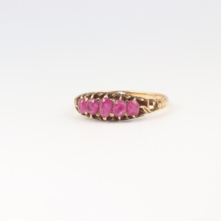 A yellow metal 5 stone ruby ring, 2.7 grams, size Q 1/2