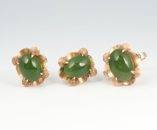 A yellow metal 14ct jade ring size L and a pair of ditto ear clips (non pierced) 9.1 grams gross 