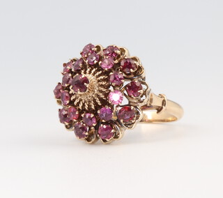 An 18ct yellow gold garnet cluster target ring 7.3 grams, size N 1/2