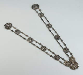 A Victorian silver cast and pierced belt decorated with cavorting cherubs, Birmingham 1897 and 1899, 138 grams