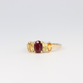 A 9ct yellow gold ruby and citrine dress ring 2.5 grams, size N 1/2