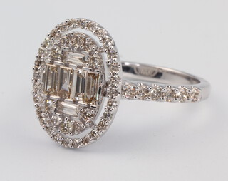 A 9ct white gold baguette and brilliant cut cocktail ring approx. 1.06ct size N, 3.2 grams 