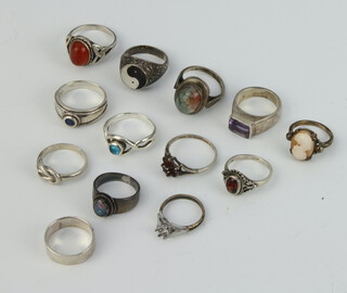 Thirteen silver dress rings, 54 grams gross