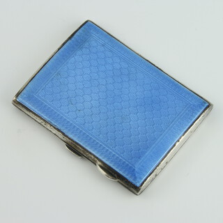 A lady's silver engine turned and blue guilloche enamelled cigarette case, Birmingham 1929, 8cm, 116 grams