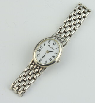 A lady's silver cased Woodford quartz wristwatch and bracelet 
