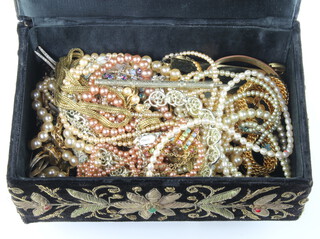 A cultured pearl necklace with a gold clasp and a quantity of vintage and other costume jewellery contained in a bullion work casket
