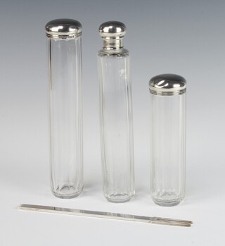 A silver 2 pronged fork Sheffield 1973, 43.5 grams together with 3 silver mounted toilet jars