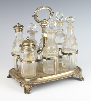A silver plated cruet stand with 7 matched bottles