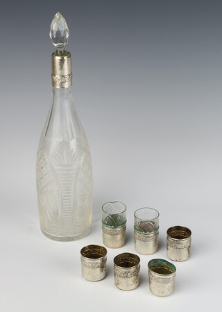A Continental cut glass spirit bottle with 800 collar together with 6 ditto tot holders 