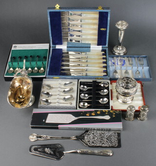 A silver plated sugar scuttle and minor place sets of plated wares 