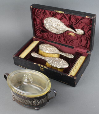 A Victorian repousse silver cased dressing table set comprising 2 hair brushes, 2 clothes brushes and a hand mirror, Birmingham 1896 and plated casserole