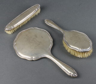 A German white metal 830 dressing table set comprising hand mirror, hair brush and clothes brush 