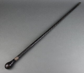 An ebonised walking cane with silver plated collar dated 1887 