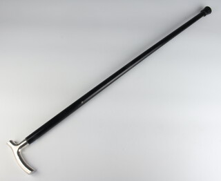 An ebonised walking cane with a silver handle Birmingham 1982 