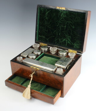 A Victorian walnut toilet box containing 12 bottles, 7 with plated lids, with a frieze drawer 