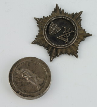 A white metal badge Bridge House States Committee dated 1865 inscribed "On laying the foundation stone of the New Bridge at Blackfriars 20th July 1865" together with a Gresham House Estate Co. Ltd anniversary silver medallion 1857-1982 no.364 of 750  