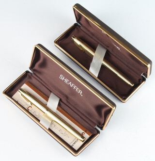 Two gold plated Sheaffer fountain pens with 14ct nibs cased