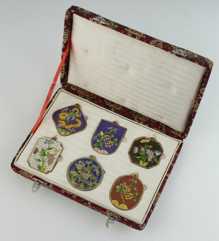 A boxed set of modern cloisonne medallions decorated with flowers, dragons and animals 