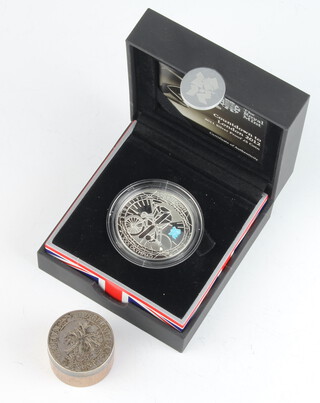 A Royal Mint silver Countdown to London 2012 proof five pound coin together with a mounted wooden box 