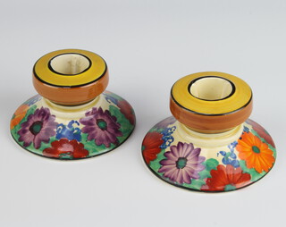 A pair of Clarice Cliff Bizarre Gayday pattern candle holders, shaped 331, 5cm 
