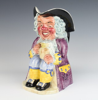 A Clarice Cliff Toby jug in the form form of a seated gentleman holding a mug of beer 26cm 