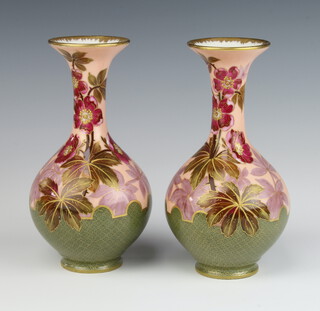 A pair of Limoges vases decorated with flowers, having flared necks 20cm 