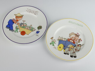 Two Mabel Lucie Attwell Shelley plates decorated with a boy pushing a wheelbarrow of pixies and a ditto of a wagon with pixies 18cm 