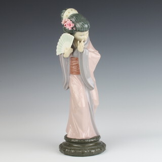 A Lladro figure of a Japanese girl holding a fan 30cm 