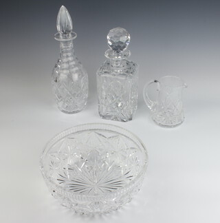 A cut glass spirit decanter 24cm, a mallet shaped ditto 27cm, a jug 12cm and fruit bowl 20cm 