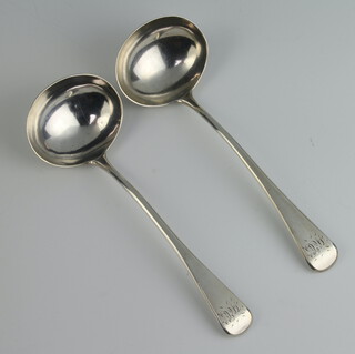 A pair of George III silver sauce ladles with engraved monogram London 1805, 92 grams 