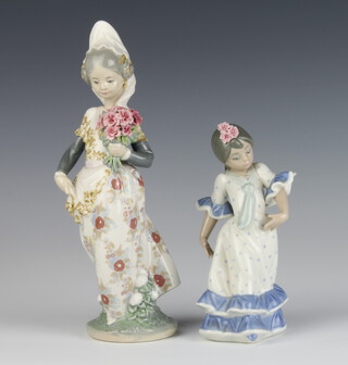 A Lladro figure of a Spanish girl 16cm, a ditto holding a bunch of flowers 1304 25cm 