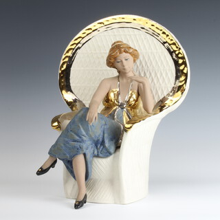 A Spanish china figure of a lady sitting in a wicker chair 30cm 