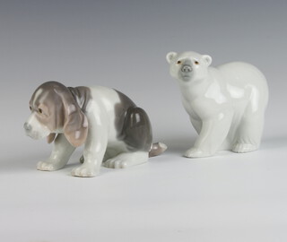 A Lladro figure of a standing polar bear 9cm, ditto of a puppy 8cm 