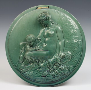 A Victorian turquoise glazed circular panel depicting a naked lady and cherub marked Clodion 28cm 
