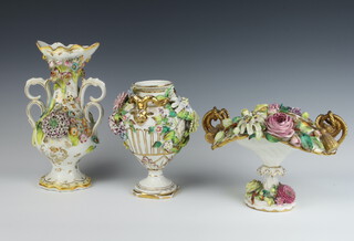 An early 20th Century German porcelain 2 handled vase with rams head handles applied with flowers 19cm, ditto 2 handled basket with rope twist handles applied with flowers 16cm and a Coalbrookdale style 2 handled vase with twin handles and applied with flowers 25cm  