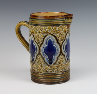 A Doulton Lambeth jug decorated with quatrefoil panels inscribed FAB and GB, 21cm 