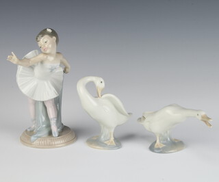 A Nao figure of a young ballerina 18cm together with 2 Lladro geese 10cm 