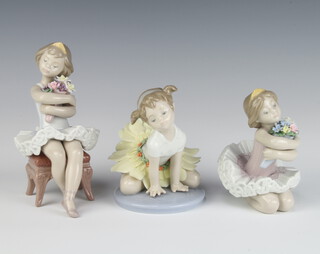 A Lladro figure of a kneeling ballerina holding flowers 11cm, a ditto 6691 12cm and another seated on a stool 15cm 