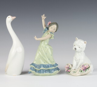 A Lladro figure of a West Highland Terrier standing on a basket of flowers 8207 11cm, ditto girl dancer 20cm and a seated goose 19cm 