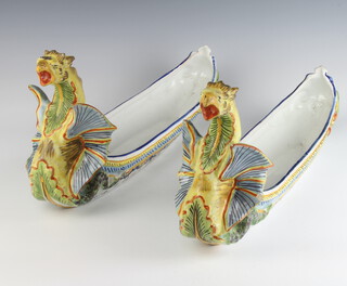 A pair of French faience boat shaped jardinieres with dragon terminals 45cm 