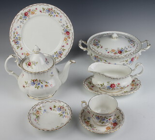 A Royal Albert Jubilee Rose part tea and dinner service comprising 5 tea cups, 6 saucers, 12 small plates, 12 medium plates and 6 dinner plates, teapot, 2 tureens and covers, sauce boat and stand, milk jug, sugar bowl, cake plate and 12 small dishes  