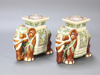 A pair of 20th Century Chinese garden seats in the form of elephants 42cm 
