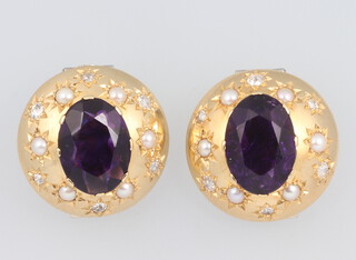 A pair of yellow metal circular ear clips (non pierced) set with 12 diamonds, each 0.03ct and each with 1 amethyst 12mm x 8mm, each with 6 seed pearls, gross weight 15.4 grams 