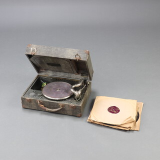 A Decca Regal portable manual gramophone contained in a fibre case marked IST U32468 together with a collection of records 15cm h x 38cm w x 28cm d 